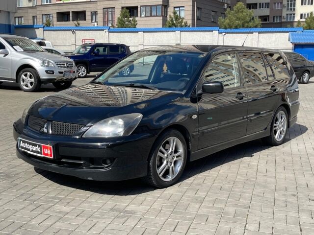 Чорний Міцубісі Lancer, об'ємом двигуна 2 л та пробігом 205 тис. км за 5490 $, фото 1 на Automoto.ua