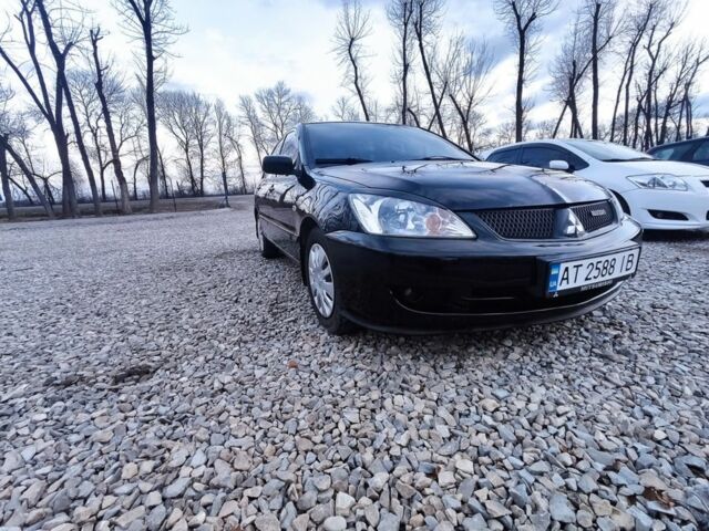 Чорний Міцубісі Lancer, об'ємом двигуна 1.6 л та пробігом 200 тис. км за 3009 $, фото 1 на Automoto.ua