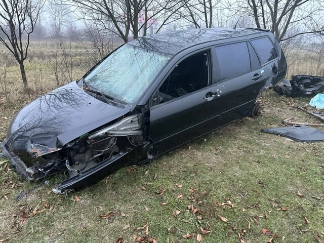 Черный Мицубиси Лансер, объемом двигателя 0 л и пробегом 300 тыс. км за 12000 $, фото 1 на Automoto.ua