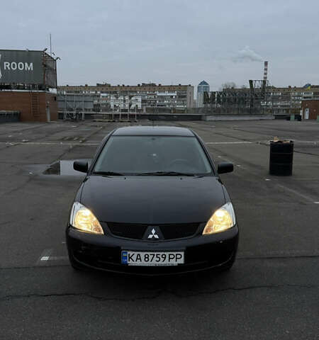 Чорний Міцубісі Lancer, об'ємом двигуна 1.58 л та пробігом 260 тис. км за 3299 $, фото 1 на Automoto.ua