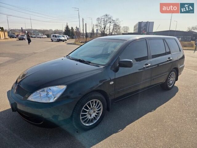 Чорний Міцубісі Lancer, об'ємом двигуна 1.58 л та пробігом 180 тис. км за 3950 $, фото 1 на Automoto.ua