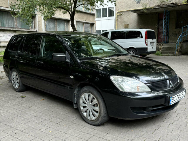 Чорний Міцубісі Lancer, об'ємом двигуна 1.58 л та пробігом 236 тис. км за 4200 $, фото 1 на Automoto.ua