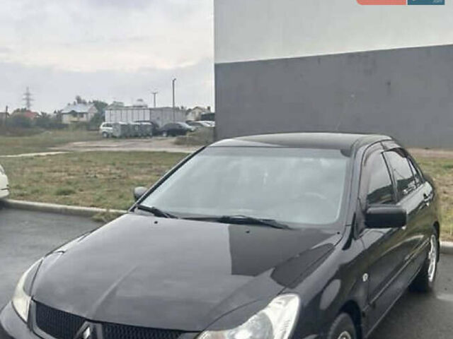 Чорний Міцубісі Lancer, об'ємом двигуна 1.58 л та пробігом 240 тис. км за 4000 $, фото 1 на Automoto.ua