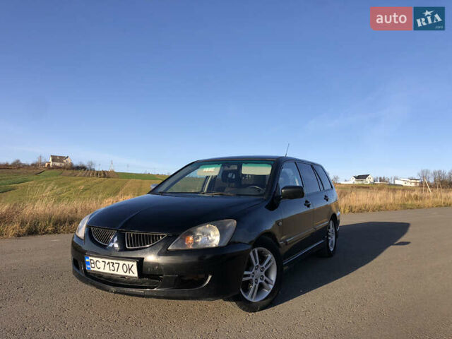 Чорний Міцубісі Lancer, об'ємом двигуна 1.58 л та пробігом 206 тис. км за 2900 $, фото 1 на Automoto.ua