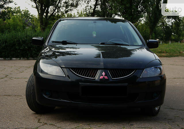 Чорний Міцубісі Lancer, об'ємом двигуна 2 л та пробігом 100 тис. км за 6200 $, фото 1 на Automoto.ua