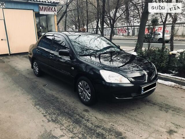 Чорний Міцубісі Lancer, об'ємом двигуна 1.6 л та пробігом 170 тис. км за 6499 $, фото 1 на Automoto.ua