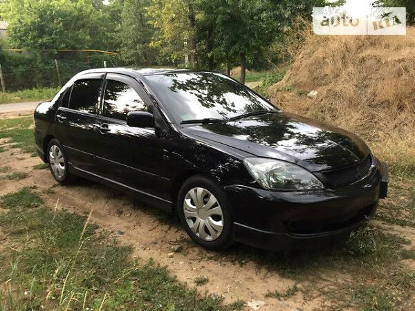 Чорний Міцубісі Lancer, об'ємом двигуна 2 л та пробігом 72 тис. км за 7300 $, фото 1 на Automoto.ua