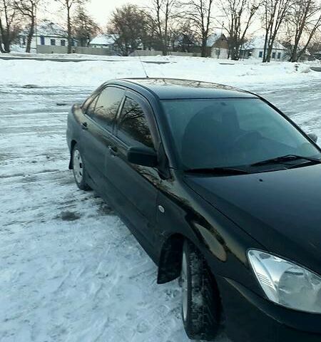 Чорний Міцубісі Lancer, об'ємом двигуна 1.6 л та пробігом 95 тис. км за 6900 $, фото 1 на Automoto.ua