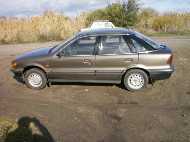 Коричневий Міцубісі Lancer, об'ємом двигуна 1.5 л та пробігом 220 тис. км за 1816 $, фото 1 на Automoto.ua