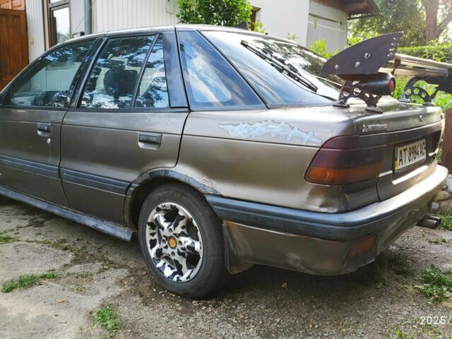 Коричневий Міцубісі Lancer, об'ємом двигуна 1.5 л та пробігом 608 тис. км за 900 $, фото 1 на Automoto.ua