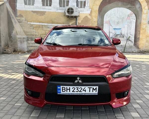 Красный Мицубиси Лансер, объемом двигателя 1.8 л и пробегом 186 тыс. км за 7300 $, фото 1 на Automoto.ua