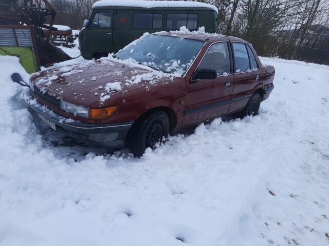 Червоний Міцубісі Lancer, об'ємом двигуна 1 л та пробігом 21 тис. км за 700 $, фото 1 на Automoto.ua