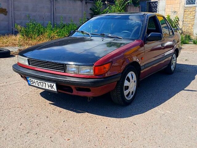 Червоний Міцубісі Lancer, об'ємом двигуна 1.3 л та пробігом 370 тис. км за 1100 $, фото 1 на Automoto.ua