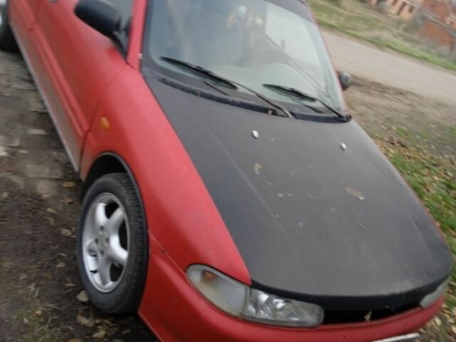 Красный Мицубиси Лансер, объемом двигателя 6 л и пробегом 1 тыс. км за 1200 $, фото 1 на Automoto.ua