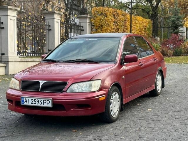 Красный Мицубиси Лансер, объемом двигателя 2 л и пробегом 350 тыс. км за 3399 $, фото 1 на Automoto.ua