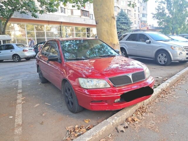 Красный Мицубиси Лансер, объемом двигателя 2 л и пробегом 202 тыс. км за 3300 $, фото 1 на Automoto.ua