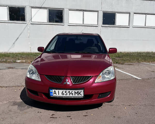 Червоний Міцубісі Lancer, об'ємом двигуна 1.58 л та пробігом 300 тис. км за 3200 $, фото 1 на Automoto.ua