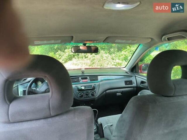 Красный Мицубиси Лансер, объемом двигателя 1.6 л и пробегом 400 тыс. км за 3100 $, фото 1 на Automoto.ua