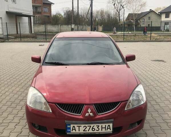 Красный Мицубиси Лансер, объемом двигателя 1.6 л и пробегом 224 тыс. км за 5500 $, фото 1 на Automoto.ua