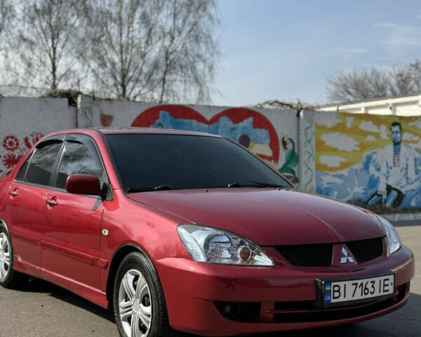 Червоний Міцубісі Lancer, об'ємом двигуна 1.6 л та пробігом 217 тис. км за 4600 $, фото 1 на Automoto.ua