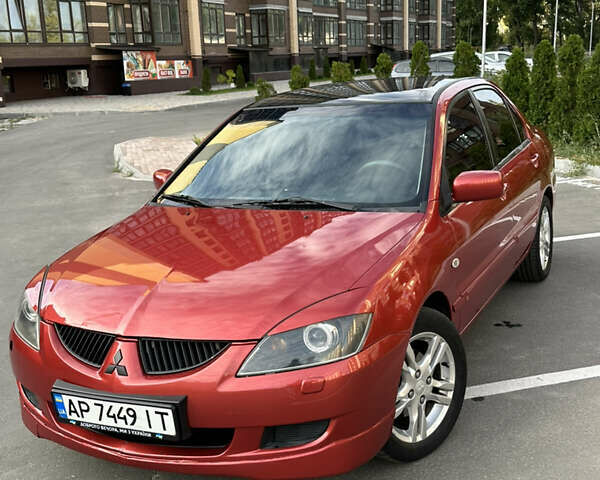 Красный Мицубиси Лансер, объемом двигателя 1.6 л и пробегом 331 тыс. км за 3700 $, фото 1 на Automoto.ua