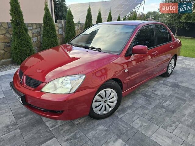 Червоний Міцубісі Lancer, об'ємом двигуна 1.6 л та пробігом 249 тис. км за 5200 $, фото 1 на Automoto.ua