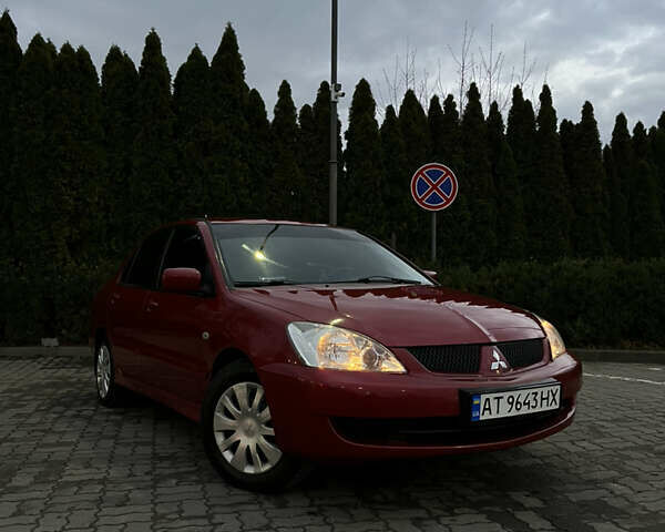 Красный Мицубиси Лансер, объемом двигателя 1.6 л и пробегом 240 тыс. км за 3500 $, фото 1 на Automoto.ua