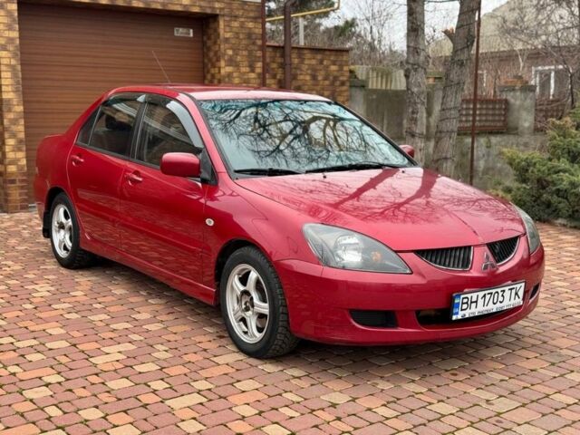 Красный Мицубиси Лансер, объемом двигателя 1.6 л и пробегом 239 тыс. км за 4100 $, фото 1 на Automoto.ua