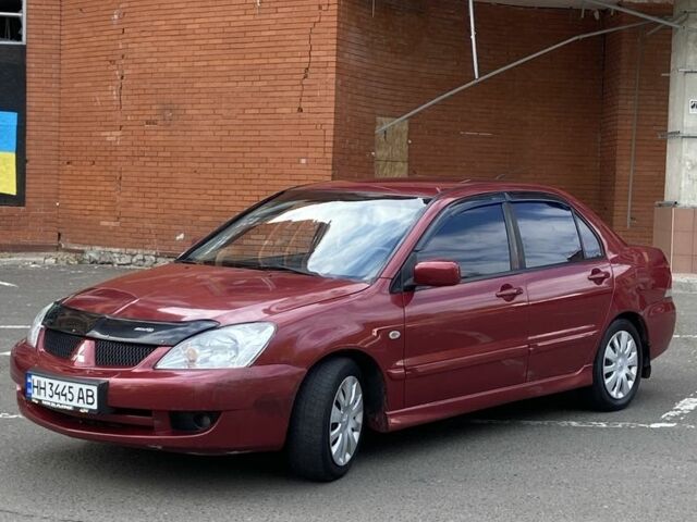 Червоний Міцубісі Lancer, об'ємом двигуна 1.6 л та пробігом 130 тис. км за 3990 $, фото 1 на Automoto.ua