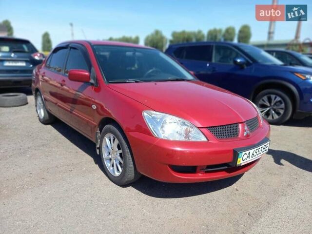 Червоний Міцубісі Lancer, об'ємом двигуна 1.6 л та пробігом 156 тис. км за 5200 $, фото 1 на Automoto.ua