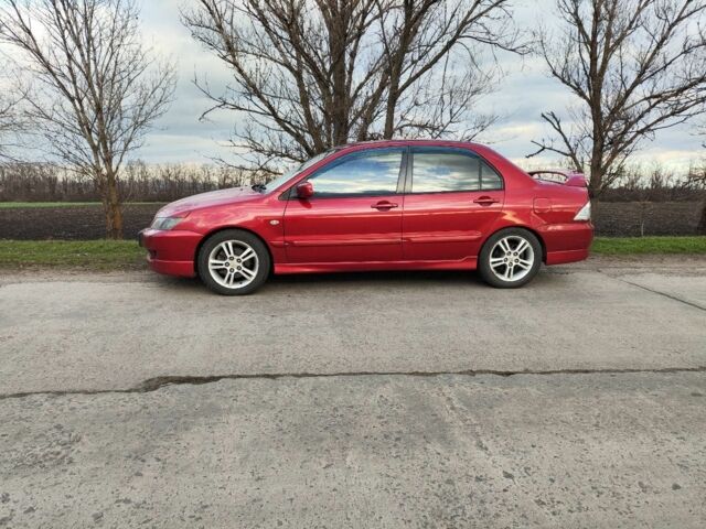 Червоний Міцубісі Lancer, об'ємом двигуна 2 л та пробігом 280 тис. км за 4500 $, фото 1 на Automoto.ua