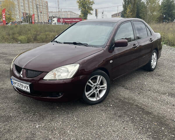 Червоний Міцубісі Lancer, об'ємом двигуна 2 л та пробігом 295 тис. км за 4150 $, фото 1 на Automoto.ua