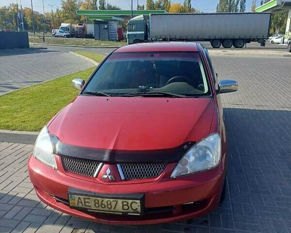 Красный Мицубиси Лансер, объемом двигателя 1.6 л и пробегом 73 тыс. км за 5500 $, фото 1 на Automoto.ua