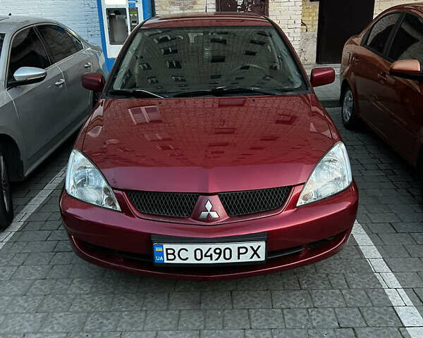 Красный Мицубиси Лансер, объемом двигателя 1.6 л и пробегом 312 тыс. км за 4600 $, фото 1 на Automoto.ua