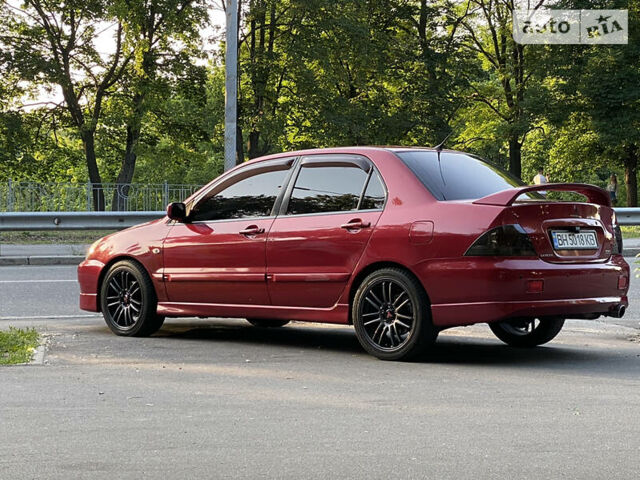 Червоний Міцубісі Lancer, об'ємом двигуна 2 л та пробігом 226 тис. км за 6000 $, фото 1 на Automoto.ua