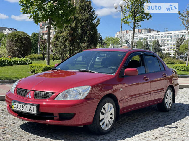 Червоний Міцубісі Lancer, об'ємом двигуна 1.58 л та пробігом 168 тис. км за 4999 $, фото 1 на Automoto.ua