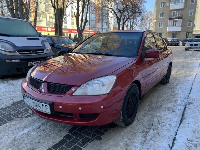 Красный Мицубиси Лансер, объемом двигателя 1.6 л и пробегом 289 тыс. км за 3350 $, фото 1 на Automoto.ua