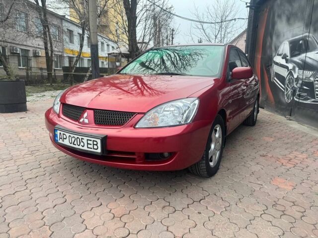 Красный Мицубиси Лансер, объемом двигателя 1.6 л и пробегом 276 тыс. км за 4350 $, фото 1 на Automoto.ua