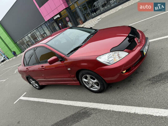 Красный Мицубиси Лансер, объемом двигателя 1.58 л и пробегом 285 тыс. км за 3650 $, фото 1 на Automoto.ua