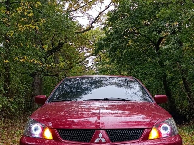 Червоний Міцубісі Lancer, об'ємом двигуна 2 л та пробігом 225 тис. км за 5505 $, фото 1 на Automoto.ua