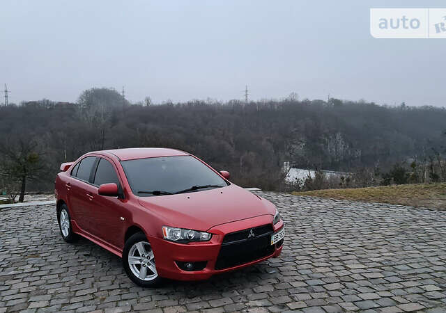 Червоний Міцубісі Lancer, об'ємом двигуна 2 л та пробігом 130 тис. км за 6500 $, фото 1 на Automoto.ua