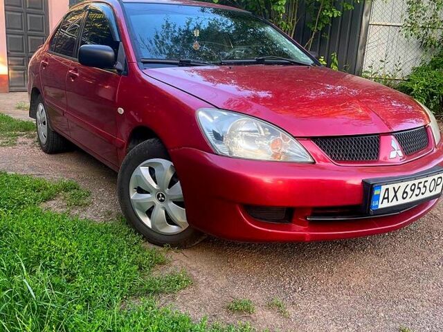 Червоний Міцубісі Lancer, об'ємом двигуна 1.6 л та пробігом 185 тис. км за 3900 $, фото 1 на Automoto.ua