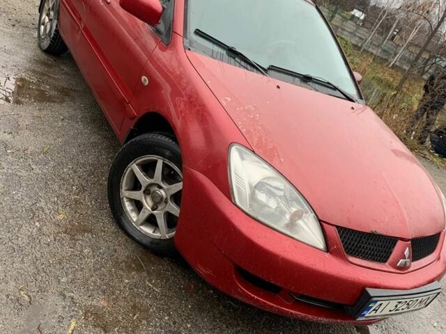 Червоний Міцубісі Lancer, об'ємом двигуна 1.6 л та пробігом 300 тис. км за 2799 $, фото 1 на Automoto.ua