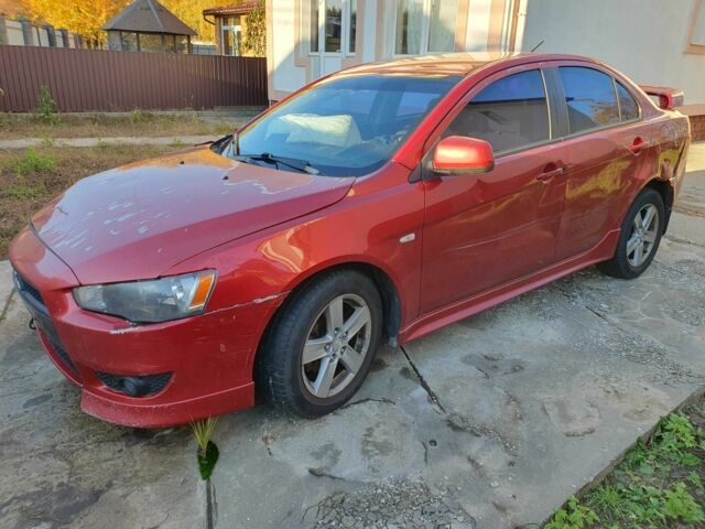 Красный Мицубиси Лансер, объемом двигателя 2 л и пробегом 406 тыс. км за 2750 $, фото 1 на Automoto.ua