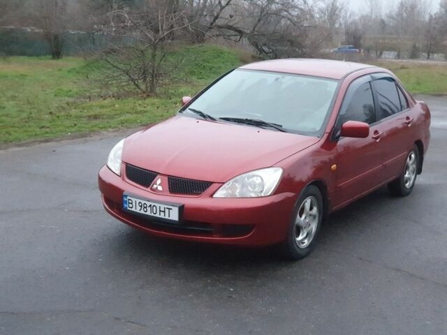 Красный Мицубиси Лансер, объемом двигателя 1.6 л и пробегом 250 тыс. км за 3700 $, фото 1 на Automoto.ua