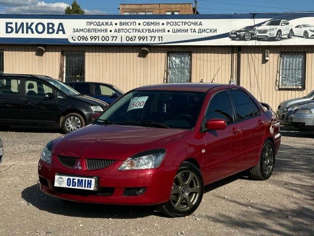 Красный Мицубиси Лансер, объемом двигателя 1.6 л и пробегом 230 тыс. км за 5300 $, фото 1 на Automoto.ua