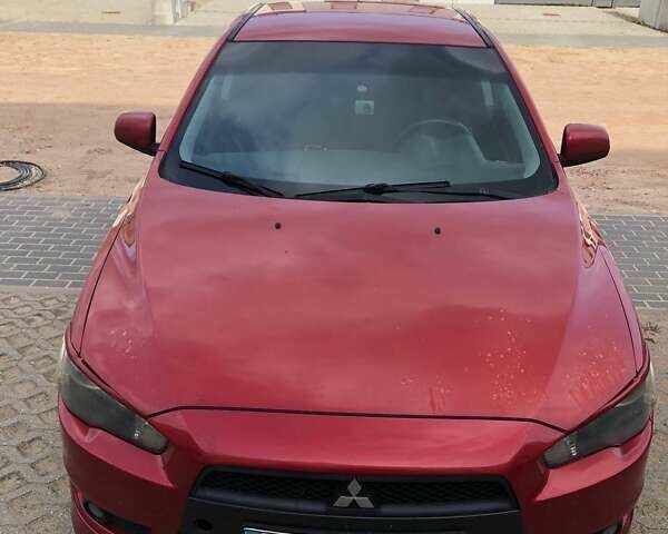 Красный Мицубиси Лансер, объемом двигателя 2 л и пробегом 198 тыс. км за 5700 $, фото 1 на Automoto.ua