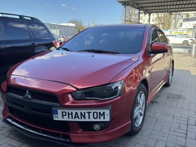 Красный Мицубиси Лансер, объемом двигателя 2 л и пробегом 267 тыс. км за 7000 $, фото 1 на Automoto.ua