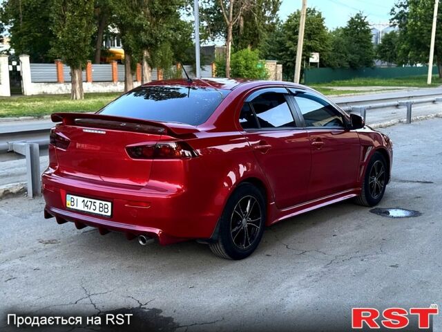Красный Мицубиси Лансер, объемом двигателя 2 л и пробегом 180 тыс. км за 6500 $, фото 1 на Automoto.ua
