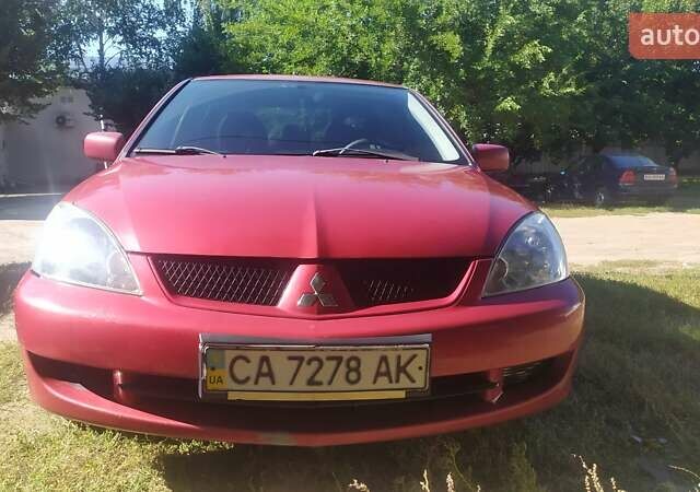 Червоний Міцубісі Lancer, об'ємом двигуна 1.58 л та пробігом 280 тис. км за 4300 $, фото 1 на Automoto.ua